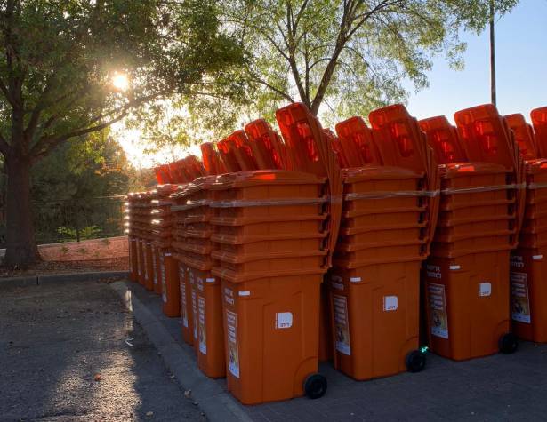 Orange recycling bins in the city Orange recycling bins in the city